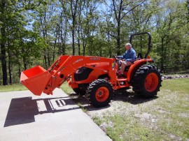 My Dad, Chuck Gore, on his new toy. He has cleared about 5 acres of forest around the house just with a chain saw. All at age 80+